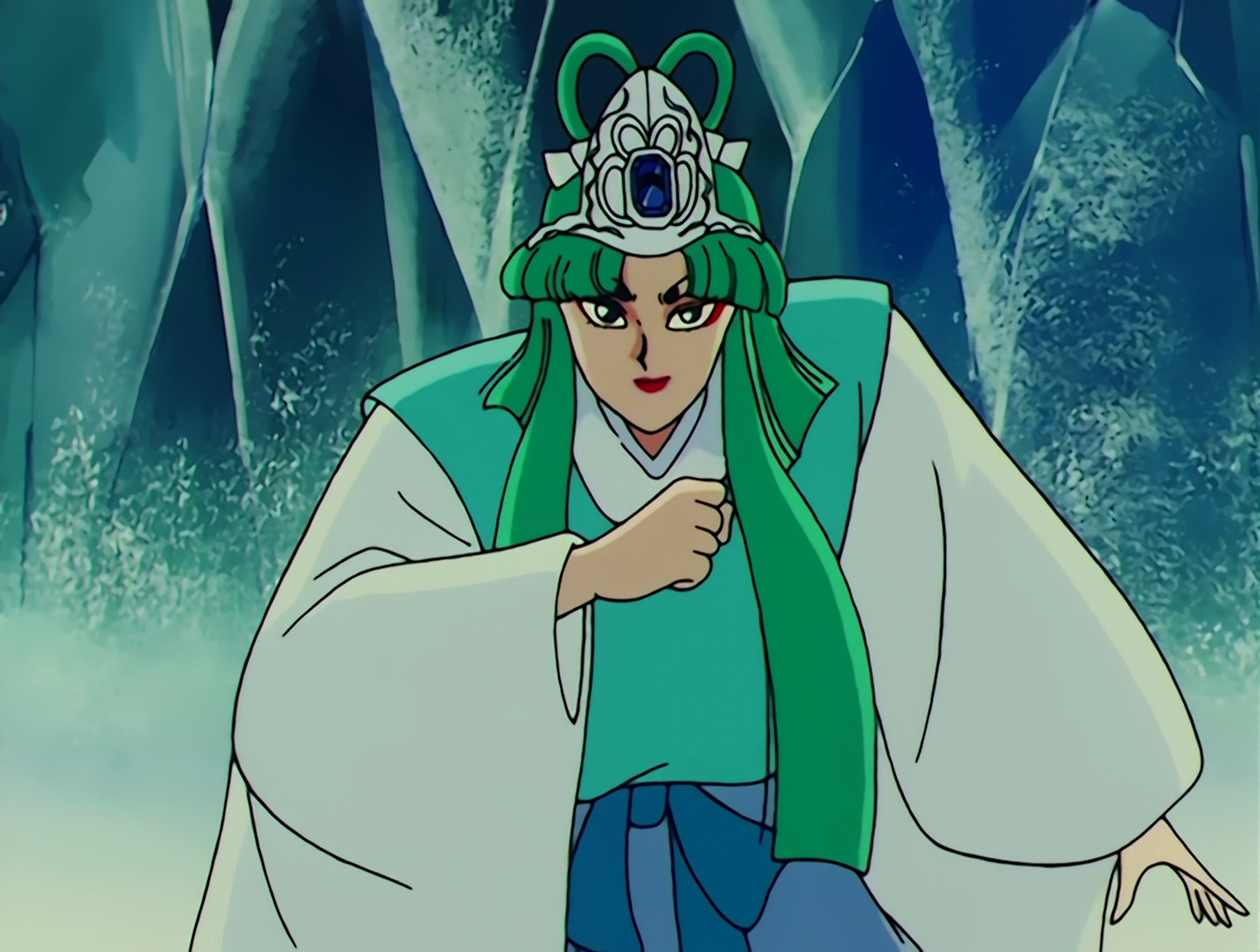 Nipasu, a Droid from Sailor Moon episode 62. She has fair skin and green hair, and wears a traditional outfit of turquoise, blue and white. She has a large silver tiara with a blue gem in its center, and she’s surrounded by ice.